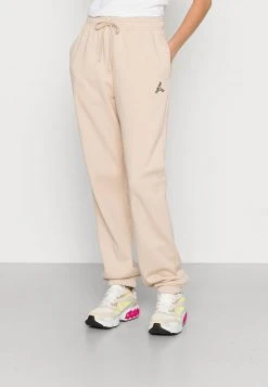 Jordan PANT CORE - Pantalones Deportivos - Sanddrift , Mujer